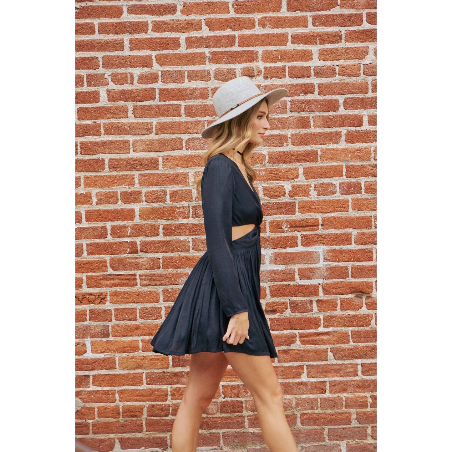 The Kassie knotted black dress with front cutout.