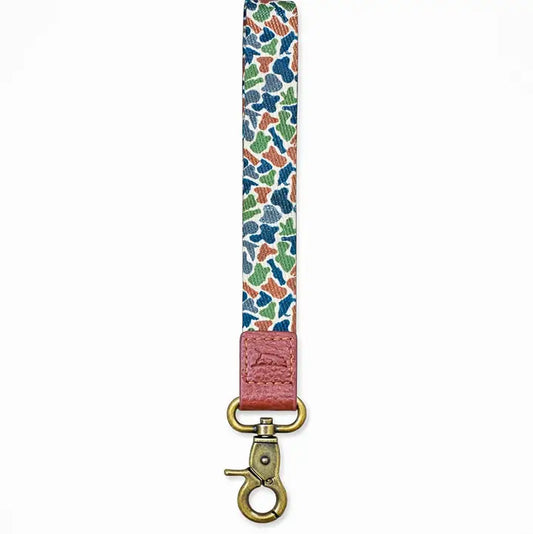 Colorful camo patterned strap with a brown end and gold clasp on a white background