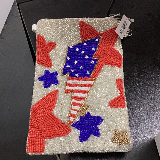 Decorative pouch with American flag design and red stars on a black surface