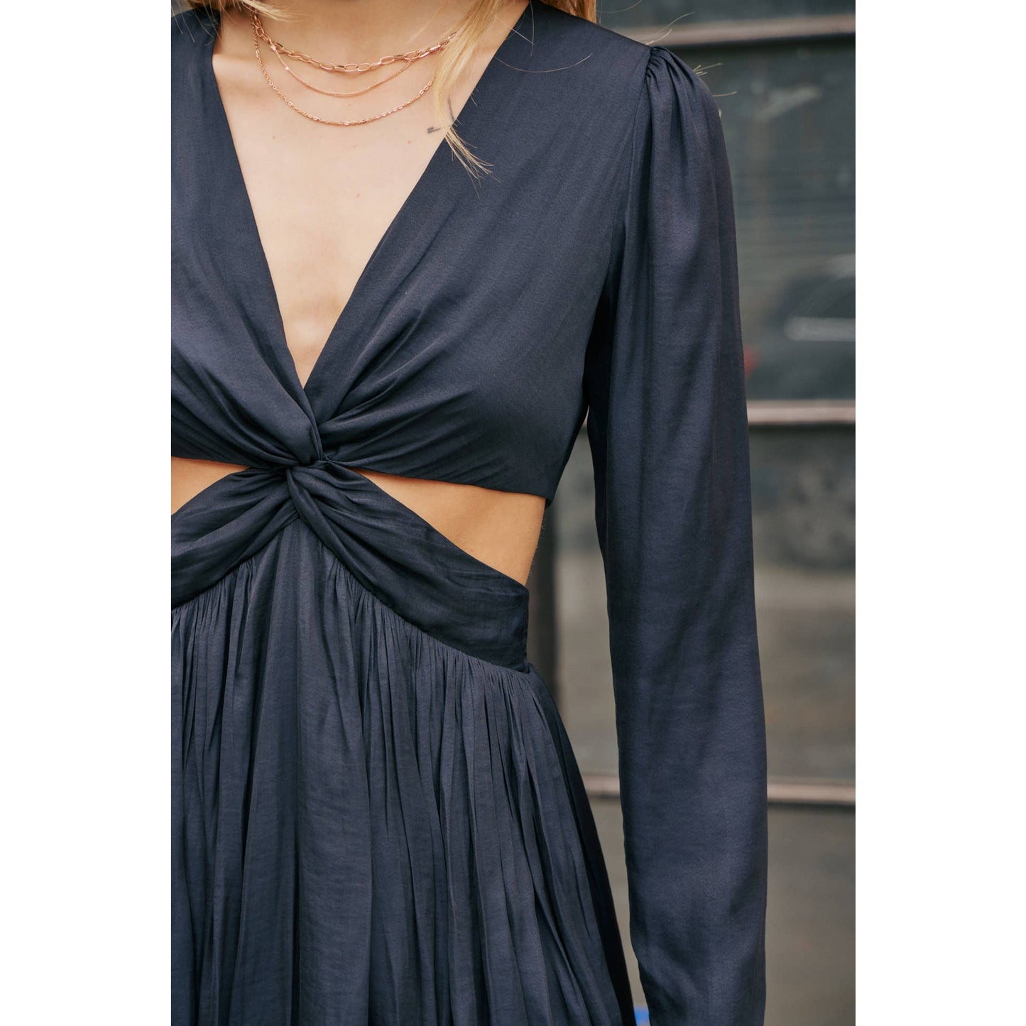 The Kassie knotted black dress with front cutout.