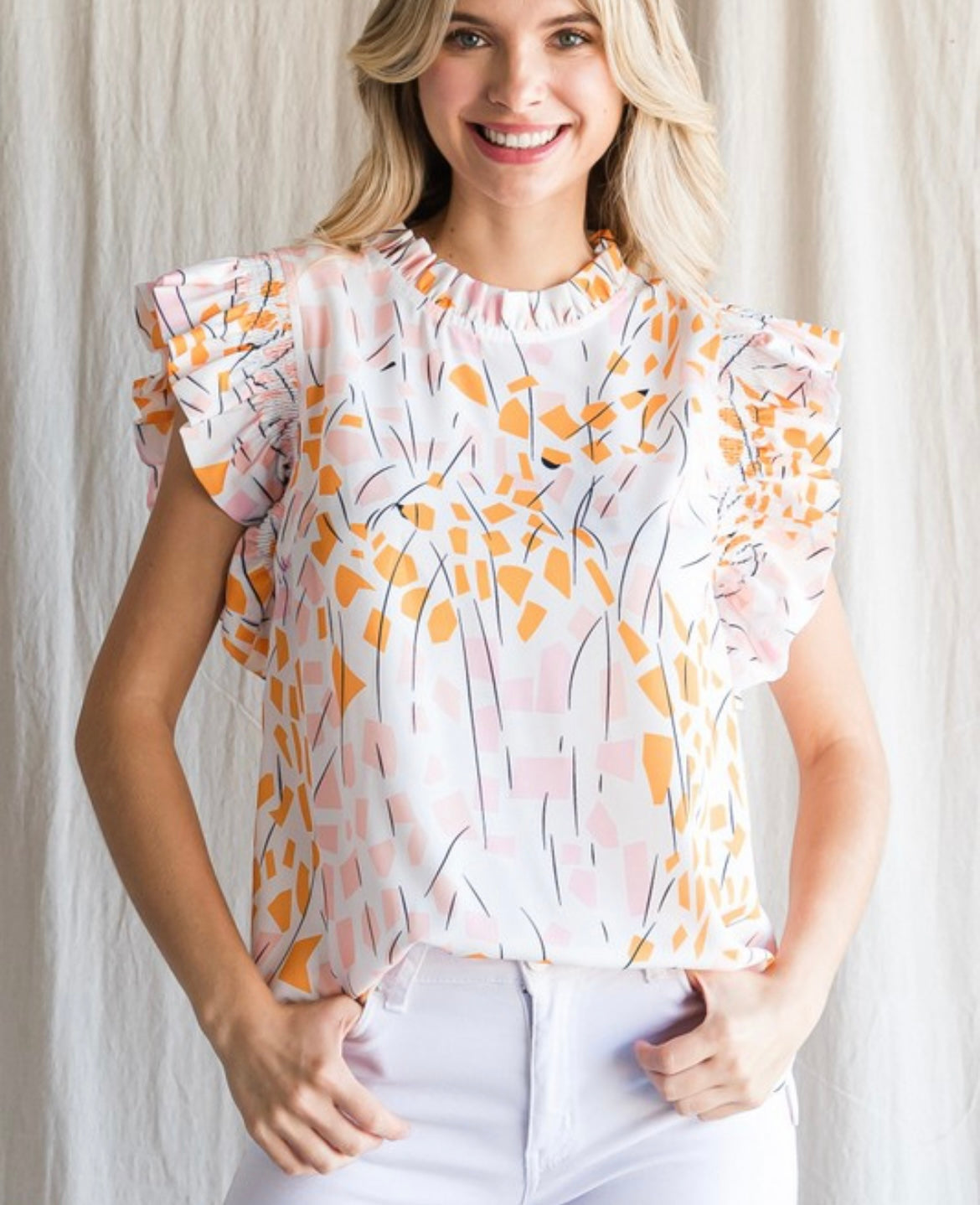 Orange leaf smocked top