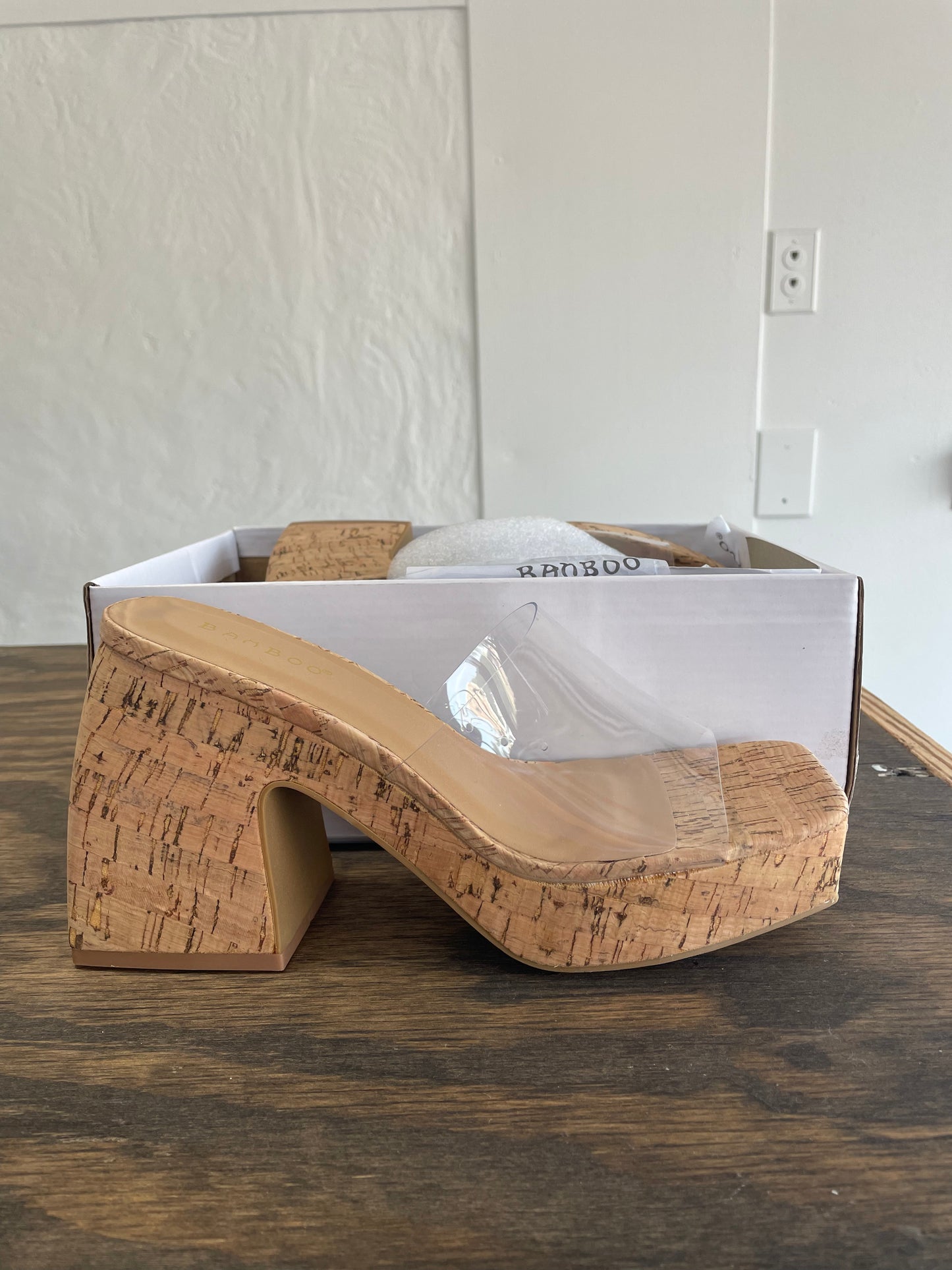 Clear heel on cork wedge