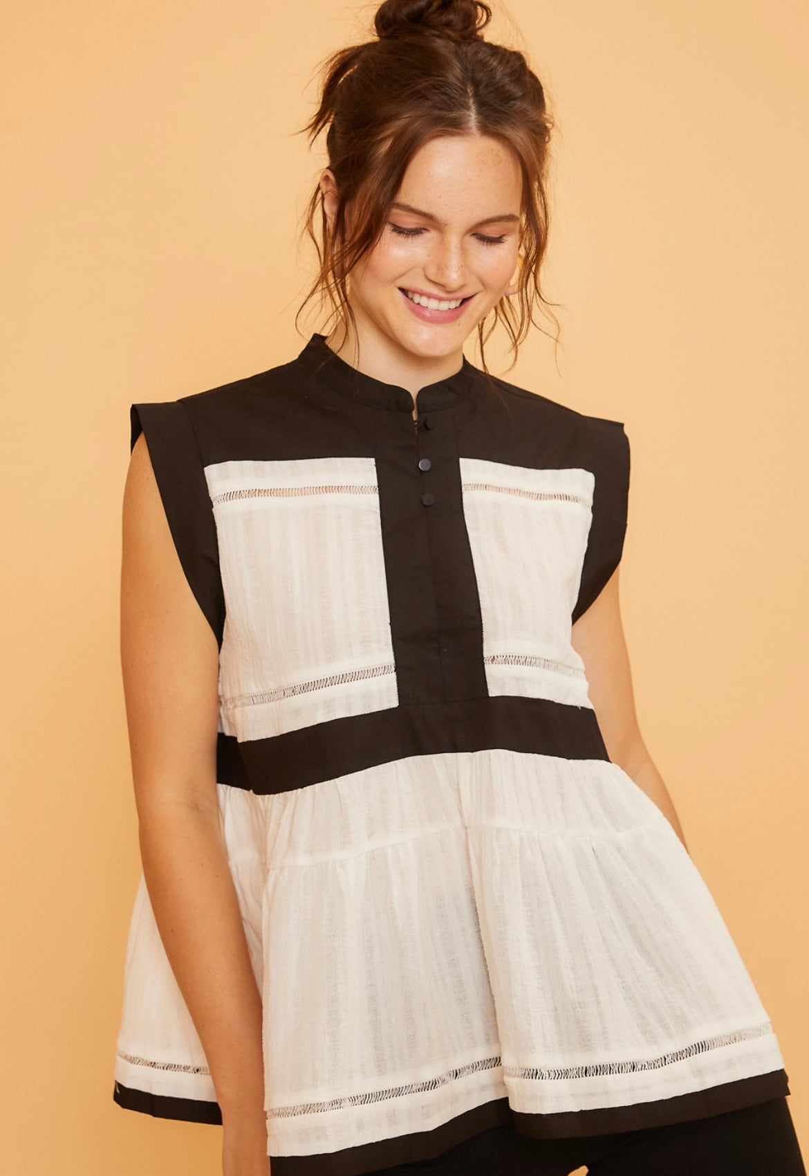 Black and cream sleeveless peplum