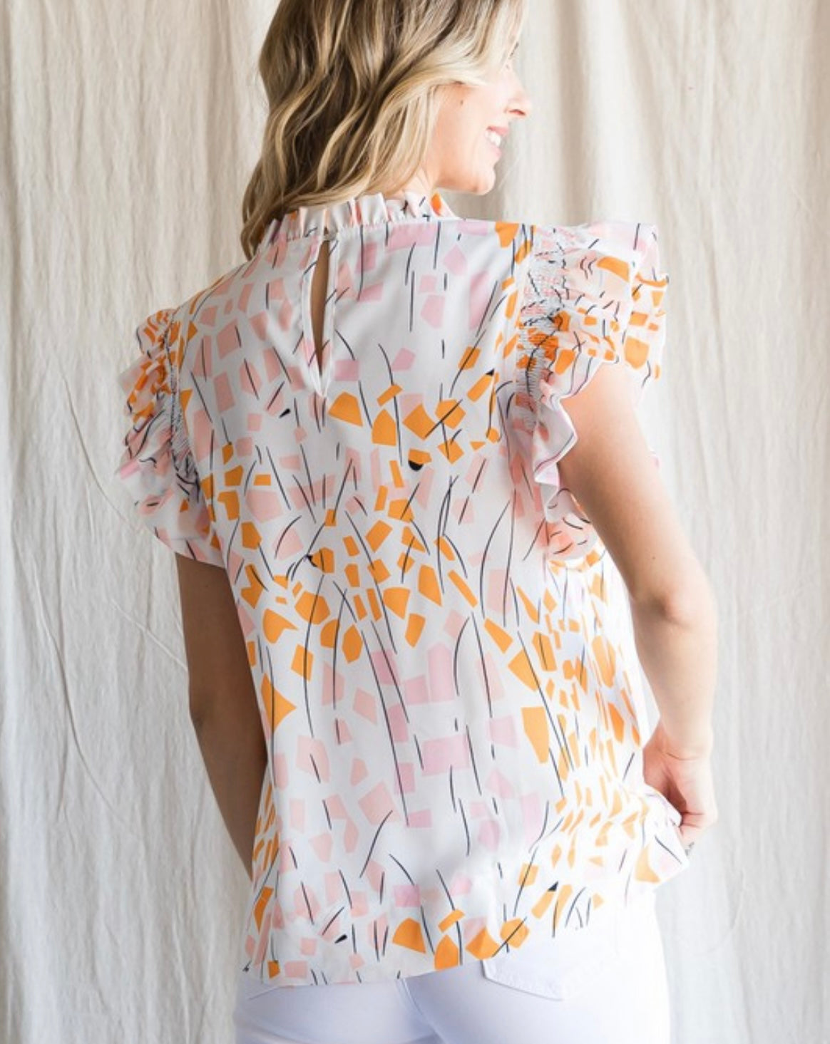 Orange leaf smocked top